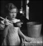 Photograph: [Young girl with ladle(1)]