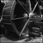 Photograph: [Water pouring over a mill wheel]