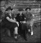 Photograph: [Three women sitting on a bench]