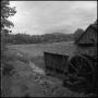 Photograph: [Watermill overlooking a field, 8]