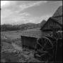 Photograph: [Watermill overlooking a field, 3]