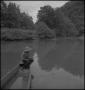 Photograph: [Raymond fishing from a boat]