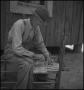Primary view of [Photo of a man making a chair]