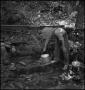 Photograph: [Fetching Water From a Spout]
