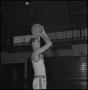 Photograph: [Carl Miller holding a basketball]