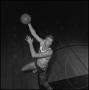 Photograph: [Dave Ebershoff jumping with a basketball]