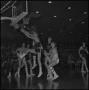 Photograph: [Basketball players reach for the ball that is in mid air, 4]