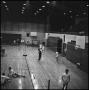 Photograph: [Men playing badminton in a gym, 3]