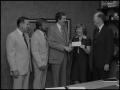 Primary view of [Representatives of Atlantic Richfield present a check to NTSU]