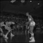 Photograph: [Basketball players fumble for the ball]