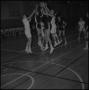 Photograph: [Basketball players jumping for the ball]