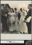 Photograph: [Ralph Richardson talking to the bride and groom, 1]