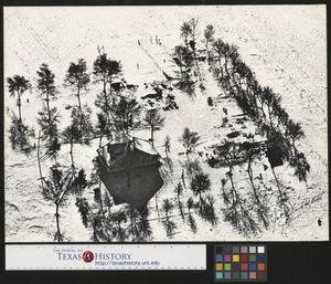 Primary view of object titled '[Aerial photograph of a snow covered home]'.