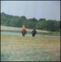 Photograph: [Two Horse Riders by a Lake]