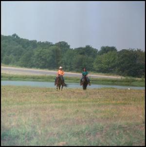 Primary view of object titled '[Two People Riding Horses]'.
