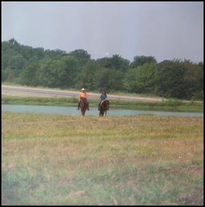Primary view of object titled '[Two Individuals Riding Horses]'.
