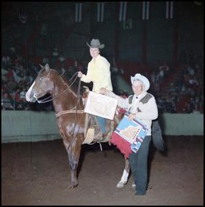 Primary view of object titled '[Woman on horse receives awards]'.