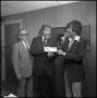 Photograph: [Man being presented with check]