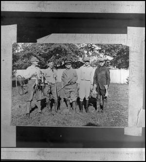 Primary view of object titled '[Group of hunters holding frogs]'.