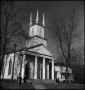 Photograph: [Four people outside of a church]