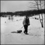 Photograph: [Woman pulling a sled up a hill]