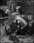 Thumbnail image of item number 1 in: '[Man repairing a telephone]'.