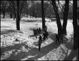 Photograph: [Children ice skating on a frozen creek, 3]