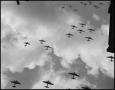 Photograph: [Several squadrons of planes flying through the sky]