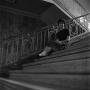 Photograph: [Betty Chapman sitting on stairs]