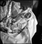 Photograph: [Baby Junebug sleeping in a blanket, 3]