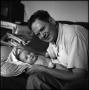 Photograph: [Joe Clark and Junebug on a couch, 5]