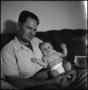 Photograph: [Joe Clark and Junebug on a couch, 7]