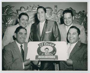Primary view of object titled '[Frank Sr. and his brothers holding El Chico sign]'.