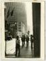Primary view of [Photograph of men walking on 7th & Main, 2]