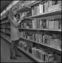 Photograph: [Student Searching for Textbooks]