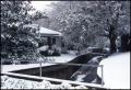 Primary view of [A bridge and house covered in snow]