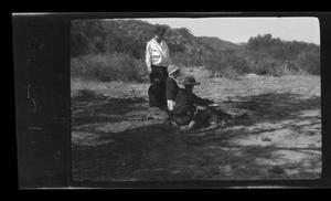 Primary view of object titled '[Irene Biffle Williams oversees her children, cooking over a camp fire]'.
