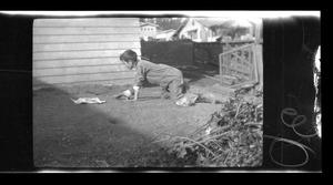 Primary view of object titled '[Byrd Williams III crawling outside]'.