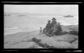 Thumbnail image of item number 1 in: '[Byrd III, Irene, Charles, and John Williams sitting on a rocky shore]'.