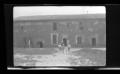 Photograph: [The Williams family entering a building]