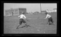 Photograph: [John Williams and Byrd Williams III fencing in a field]