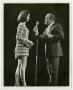 Photograph: [Shirley Cothran Barret, Miss America 1975, on stage with Bob Hope]