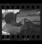 Photograph: [Roger driving a 1956 Ford Sunliner]