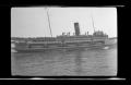 Photograph: [A ship with passengers on a body of water]