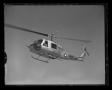 Photograph: [The Bell YH-40 helicopter in flight]