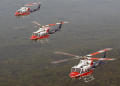 Photograph: [Photograph of three AirCare helicopters]
