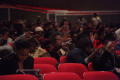 Primary view of [Audience extending their hands towards the performance, 2]