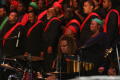 Photograph: [Close-up of Drummer Performing with Choir]