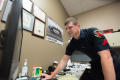 Photograph: [University of North Texas security guard in his office]