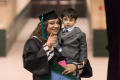 Primary view of [Graduating Student and her Son]